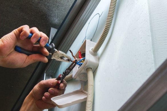 Installation of electrical boxes, the electrician mounts the ele